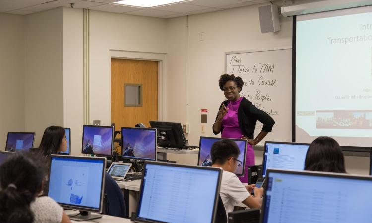 Professor Adjo Amekudzi-Kennedy teaching students in a computer lab.