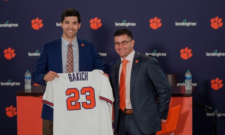 Clemson athletic director and Georgia Tech graduate Graham Neff (left) poses with new Tigers baseball coach Erik Backich at a news conference announcing his hire in June. (Clemson Athletics) 