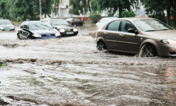 Cars driving through flood waters 