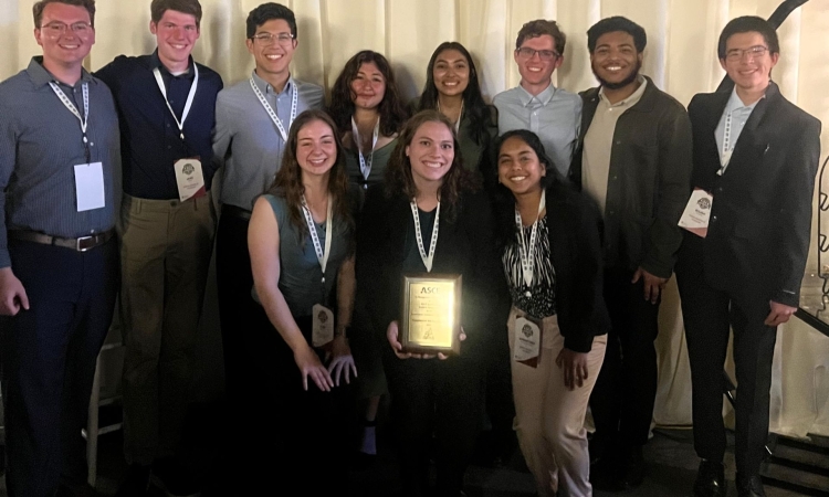 Group of 10 students of the Sustainable Solutions team pose holding the plaque commemorating their win at the 2025 Regional ASCE Student Symposium.