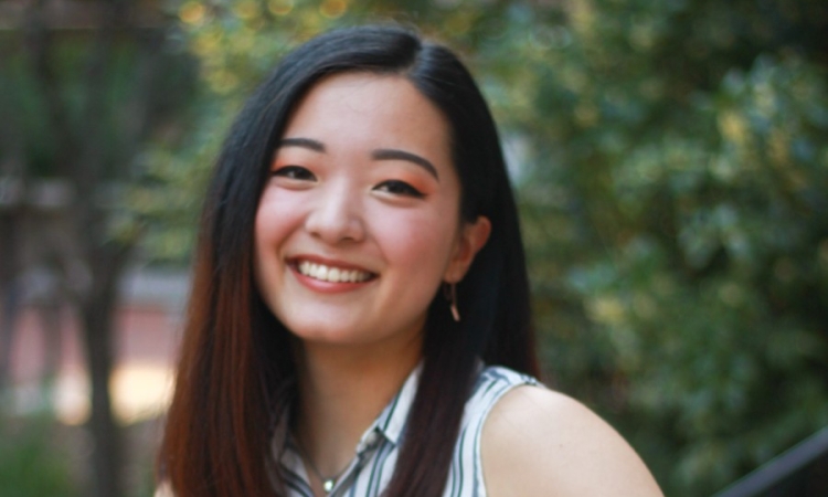 Zoe Zhang smiles for a photograph.