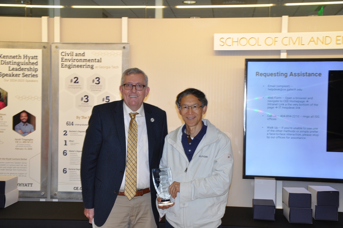 Chair Don Webster with Professor Yongshen Chen holding award