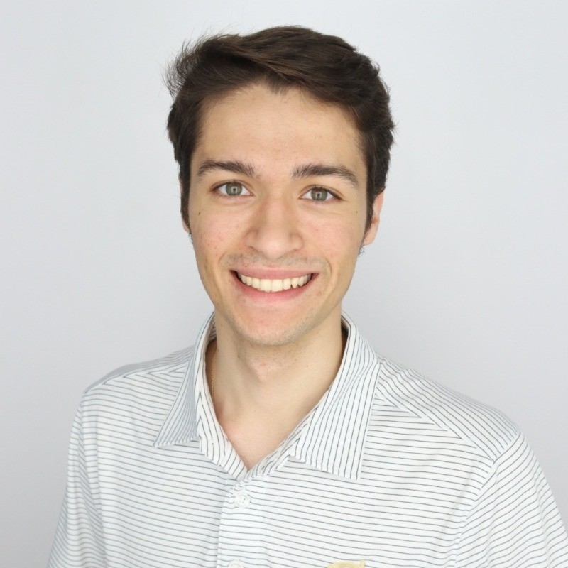 Portrait of Tulio Sulbaran wearing a striped white shirt