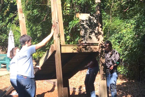 Students from the Georgia Tech chapter of the American Society of Civil Engineers take down a piece of playground equipment for International Women's House in Decatur, Georgia. (Photo Courtesy: ASCE Georgia Tech)