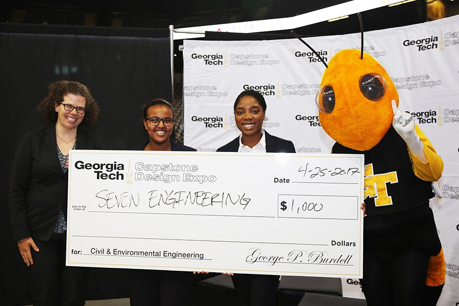 Team SEVEN Engineering with Buzz and Associate Professor Kari Watkins after they won for the best project among civil and environmental engineering teams at the spring 2017 Capstone Design Expo. Kemeria Abdella and Sharani White, middle, designed a full site development plan for a proposed medical office building in Cobb County, Georgia, along with Cathy Wong and Ming Yang. (Photo: Jess Hunt-Ralston)